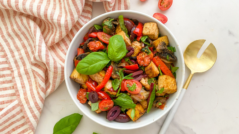 Mediterranean sheet pan tofu in white bowl