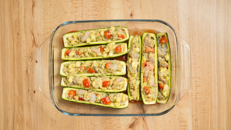 stuffed zucchini boats in pan 