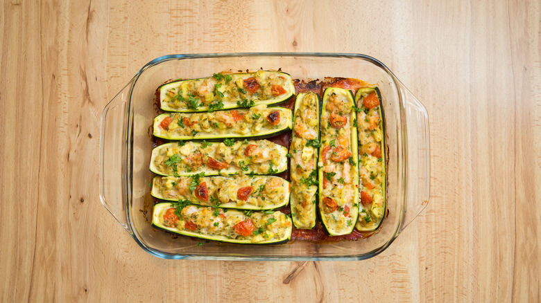 cooked zucchini boats in pan 