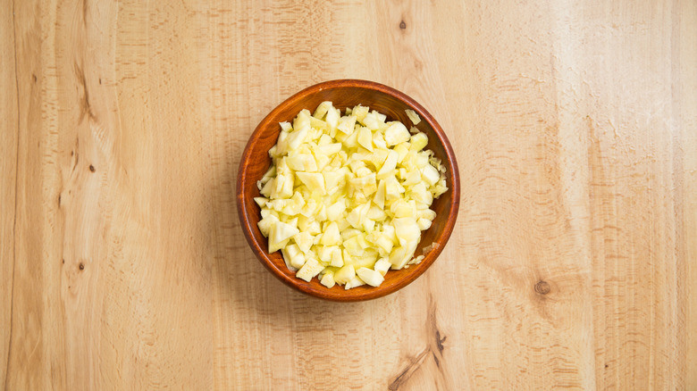 diced zucchini in wooden bowl 