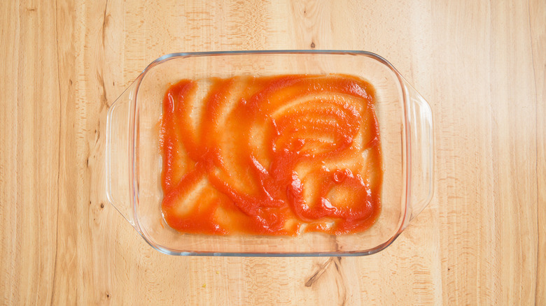 baking dish with tomato puree