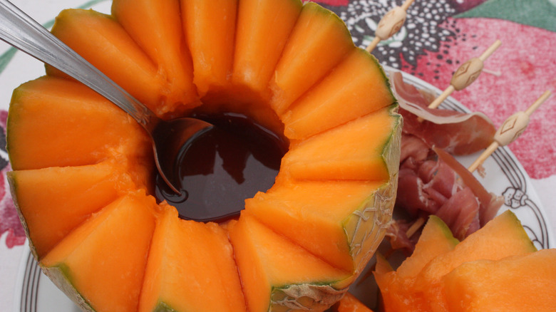 halved melon filled with port