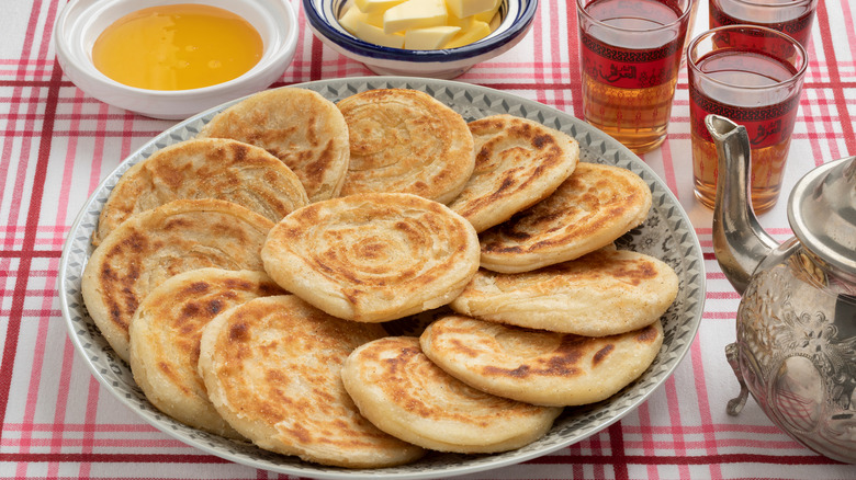 Meloui served with butter, honey, and tea