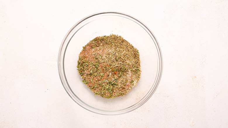 Spices combined in glass bowl