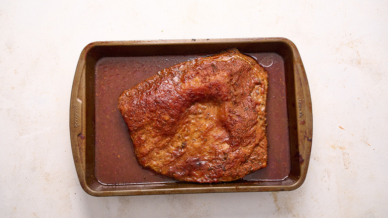 Brisket roasting in pan
