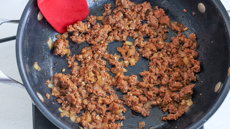 chorizo and onion in skillet 