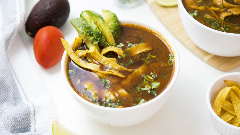 Mexican tortilla soup on table