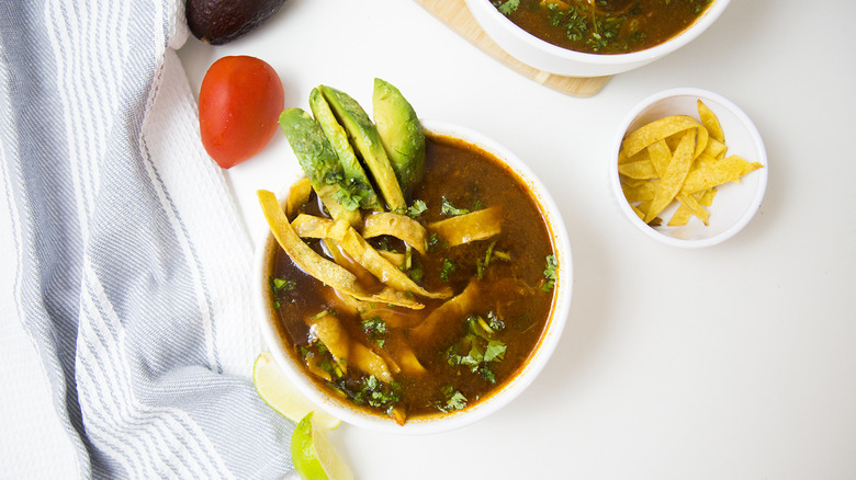 Mexican tortilla soup on table