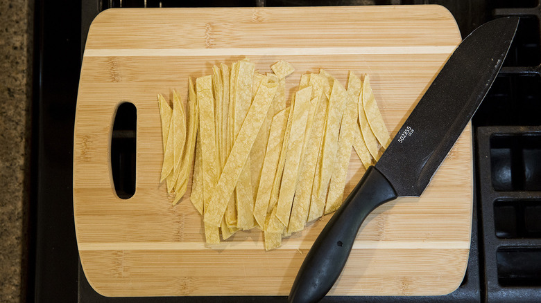 tortilla strips on cutting board