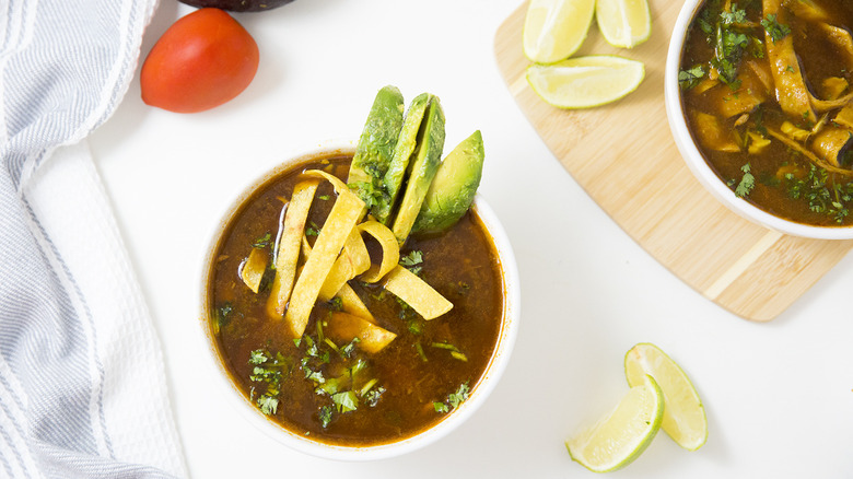 Mexican tortilla soup on table