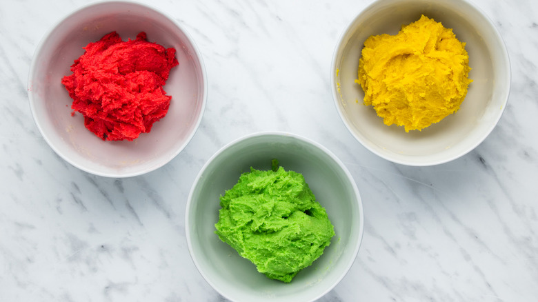 bowls of colored cookie dough