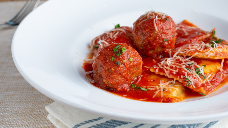 meatballs served with ravioli on plate