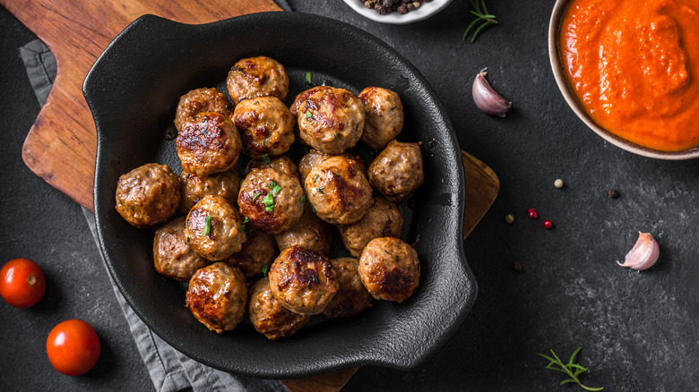 Cooked meatballs in a skillet