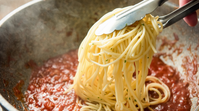 Pasta over sauce pan