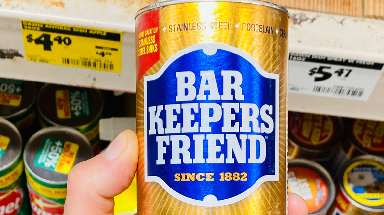 A tube of Bar Keeper's Friend in front of a store shelf