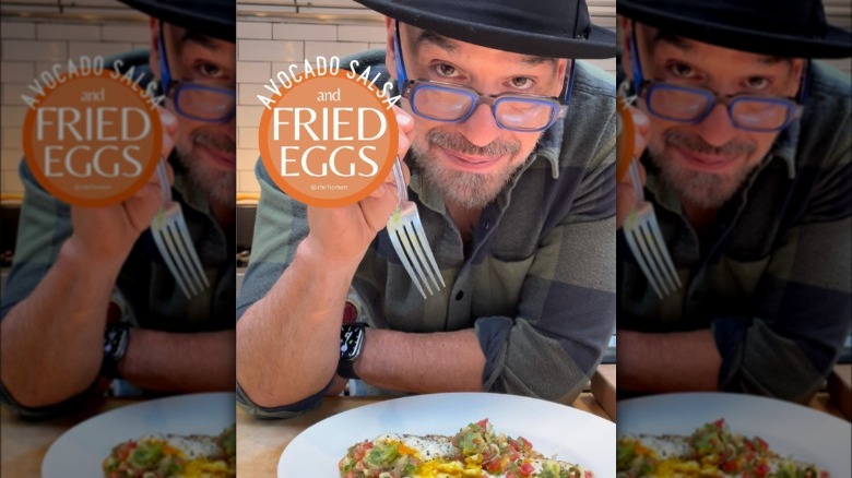 Michael Symon posing for fried eggs recipe promo