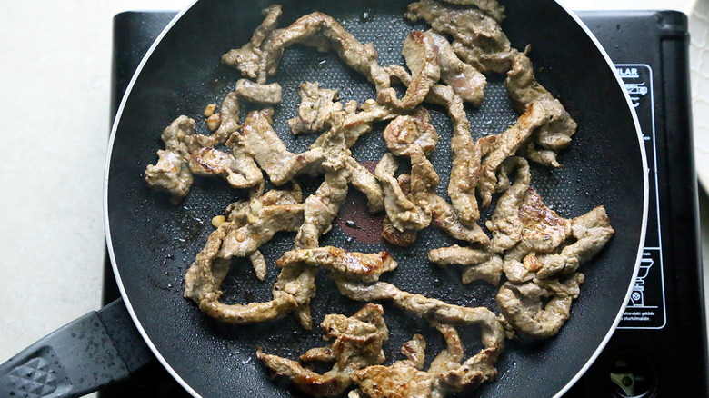 cooking beef in skillet