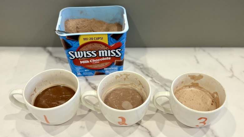 Three hot cocoa cups with Swiss miss mix