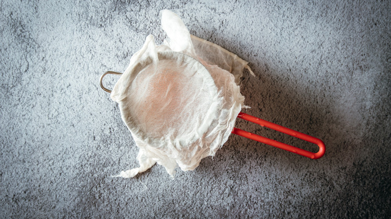 Cheesecloth in strainer