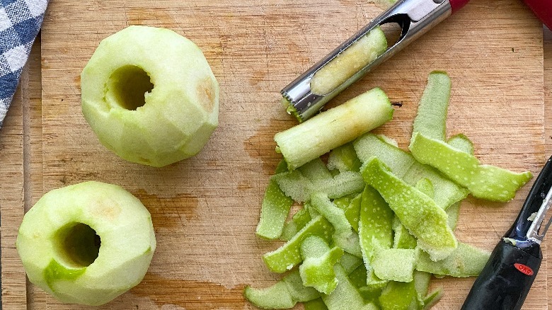 cored and peeled apples on board