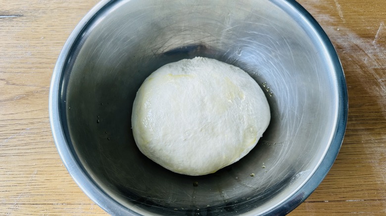 pizza dough ball in bowl