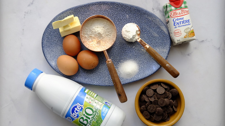 chocolate eclairs ingredients on counter 