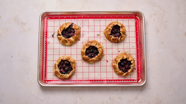 browned galettes on sheet tray