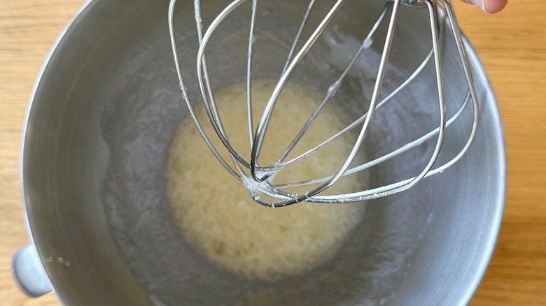 Egg whites and sugar in mixing bowl