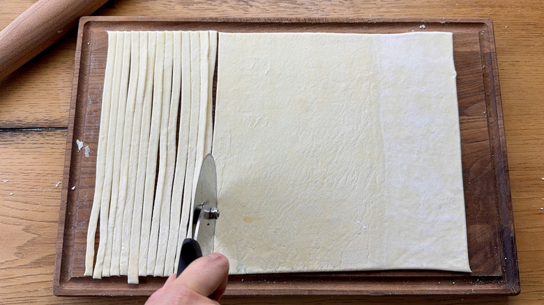 Cutting strips of puff pastry