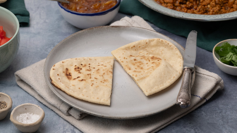 sliced pita bread on plates