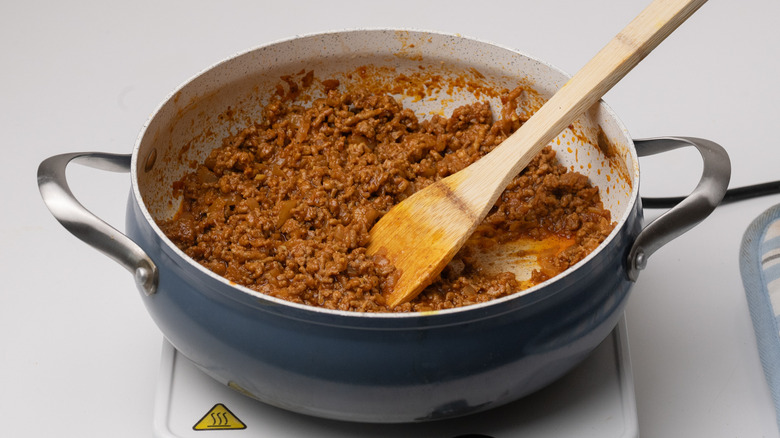 lamb mixture simmering in pan