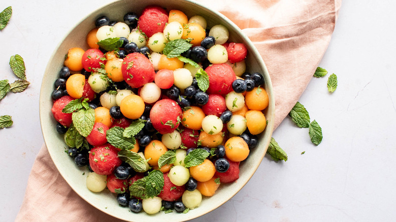 melon balls, blueberries, and mint