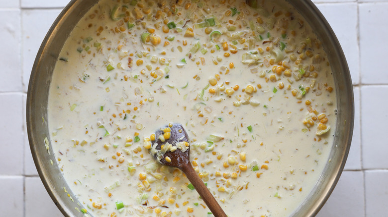 Cream and corn in pan