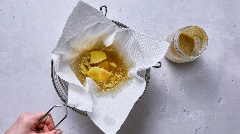 straining butter out of brandy