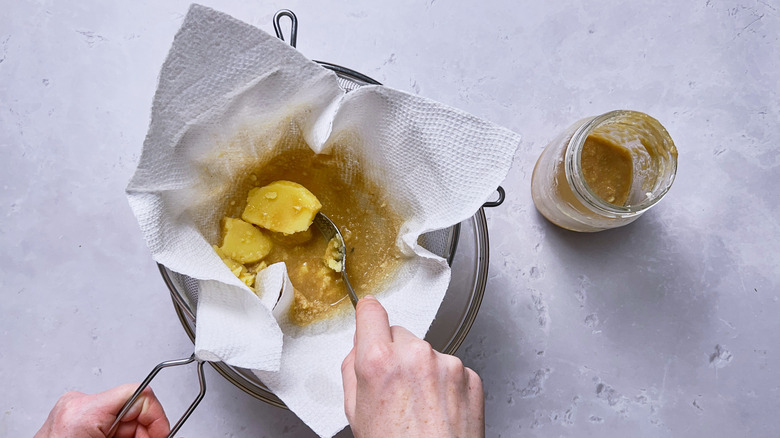 straining butter out of brandy