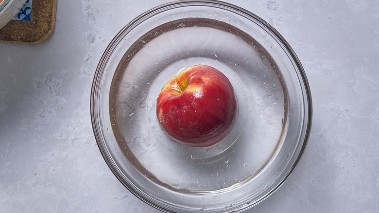 apple soaking in bowl