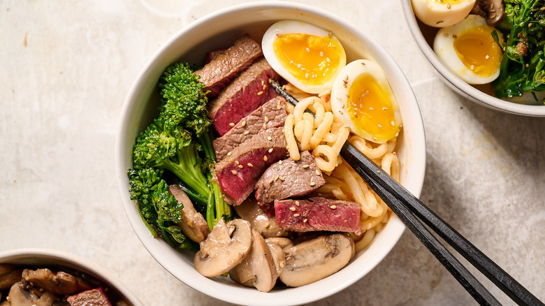 beef noodle bowl on table