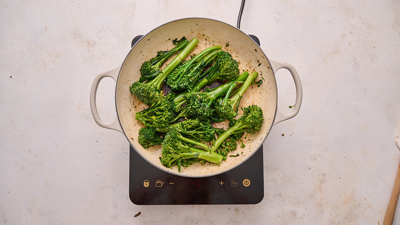 cooking broccolini in skillet