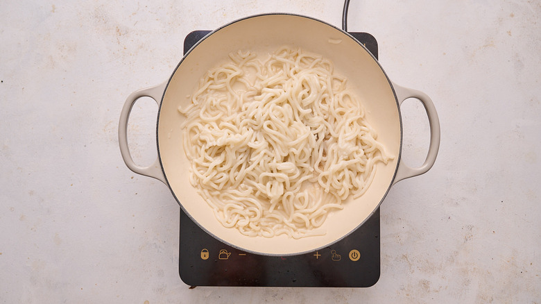 cooking noodles in skillet