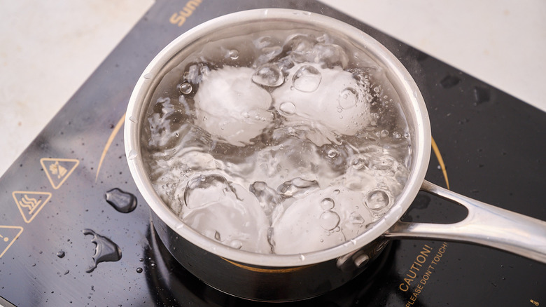 boiling eggs in pot