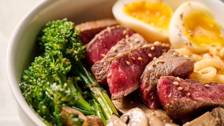 steak and broccolini in bowl