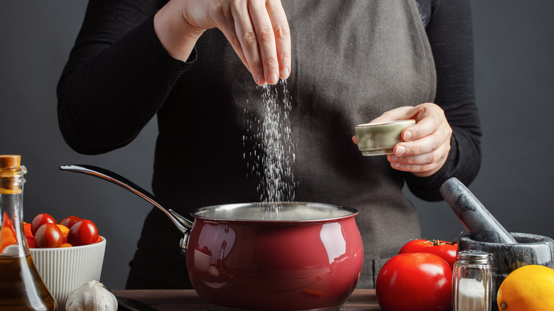 Adding salt to boiling water