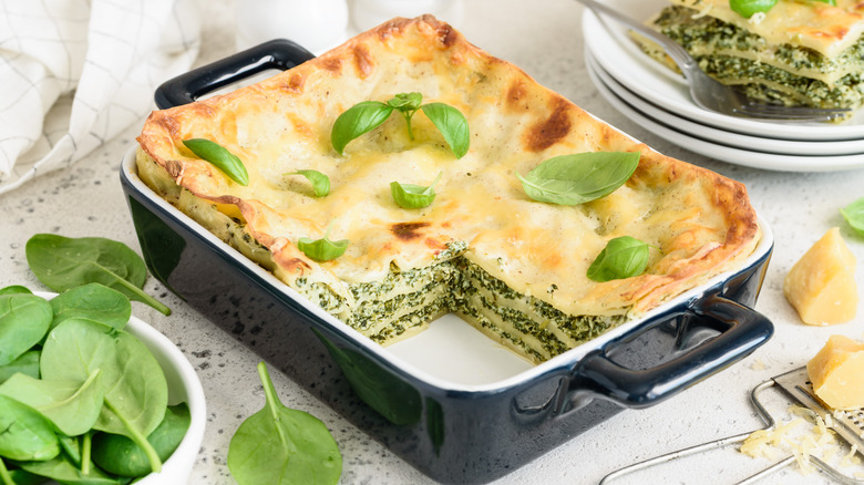 Spinach lasagna in black dish