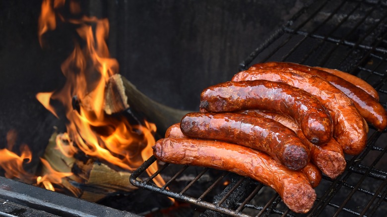 sausage on grill with flames