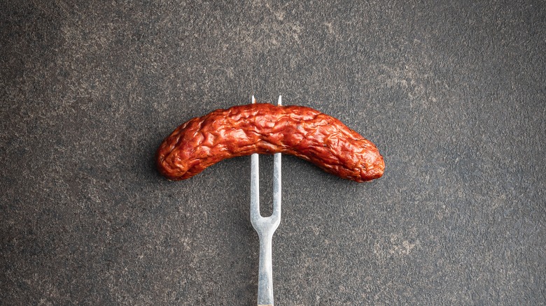 fork pricking sausage