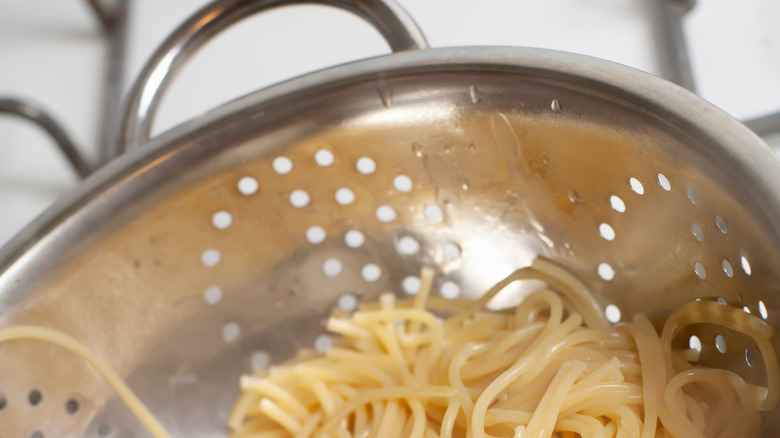 spaghetti in a colander