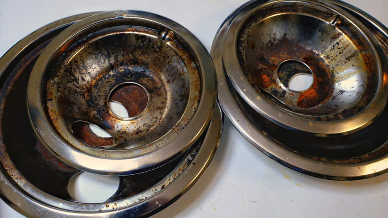 dirty drip pans from a stove