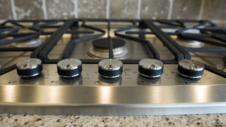 clean gas stovetop with knobs