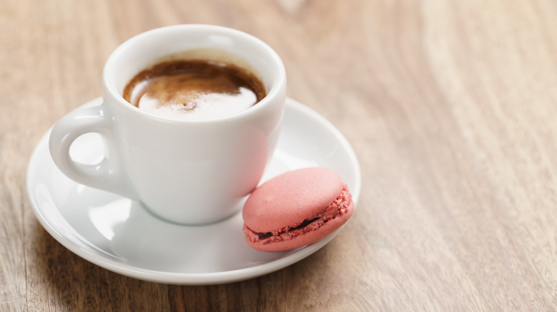 Cup of espresso with cookie