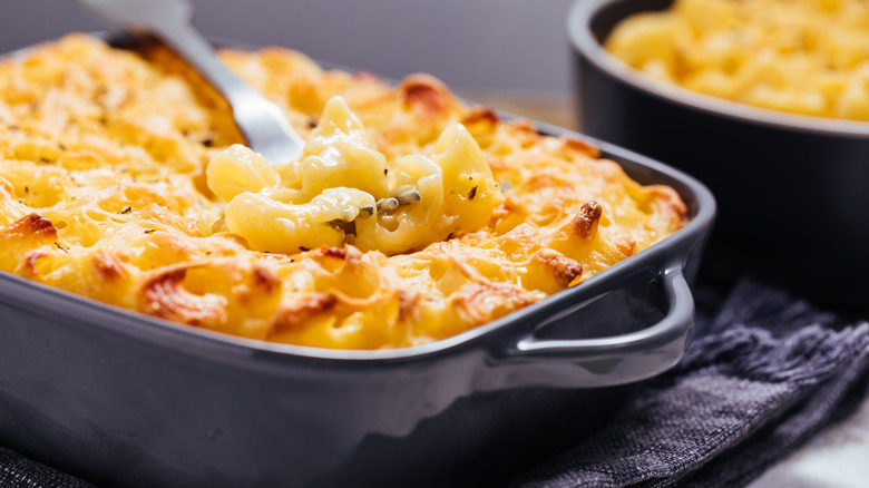 baked mac and cheese in dish with fork